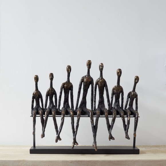 A friendship bench sculpture, a sculpture made from bronze and resin