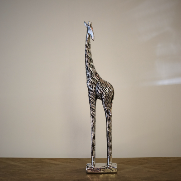A silver giraffe decor sculpture with textured finish