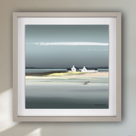 framed coastal picture hung on neutral wall