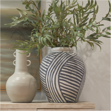 large striped earthenware vase with stems