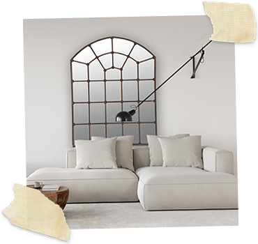 iron arch frame mirror on wall with sofa in front