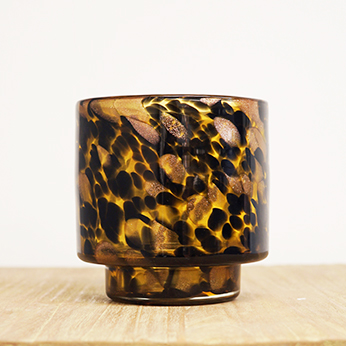 a brown and black tortoiseshell candleholder