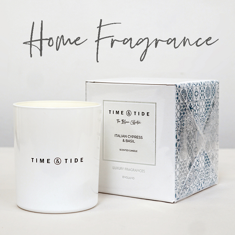 A Time & Tide scented jar candle with blue printed box and text "Fragrance"