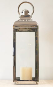 polished steel lantern with alter candle inside