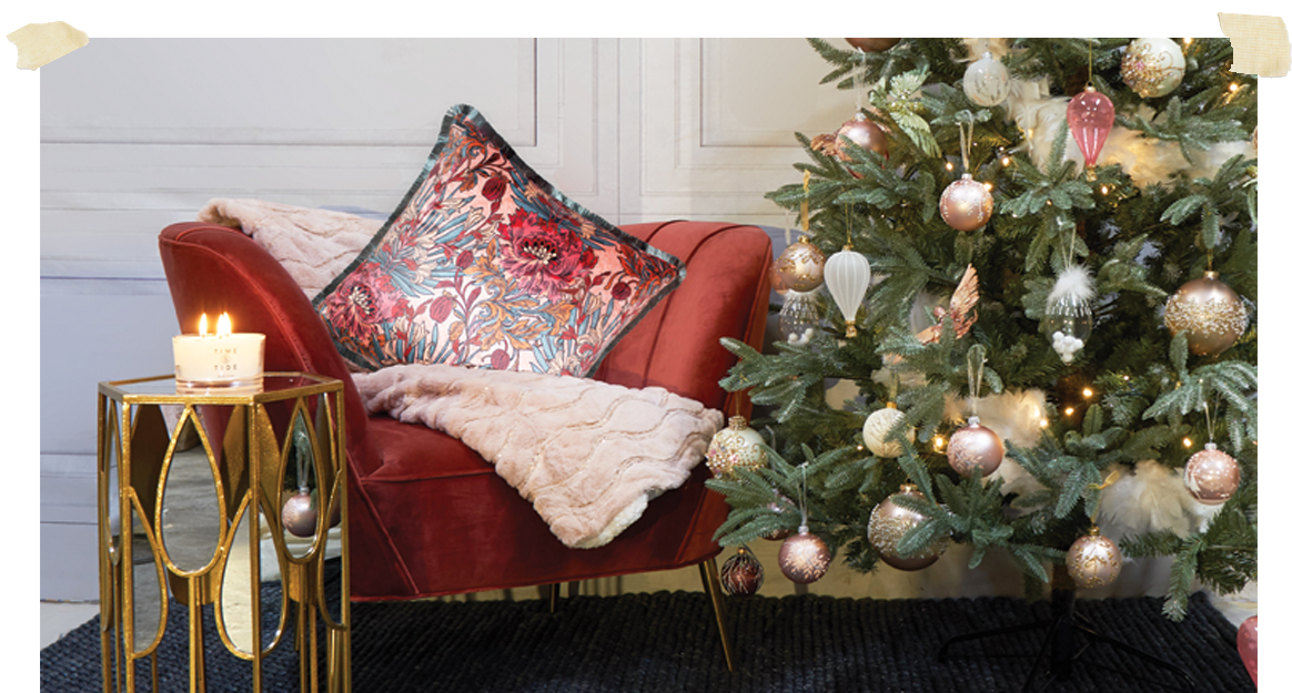 Room dressed for Christmas with Christmas Tree, Occasional Chair and Candle
