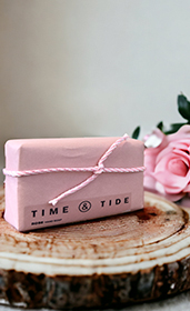 wrapped luxury soap bars piled on table