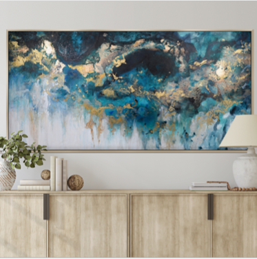 blue and gold abstract wall art print hung above dressed sideboard